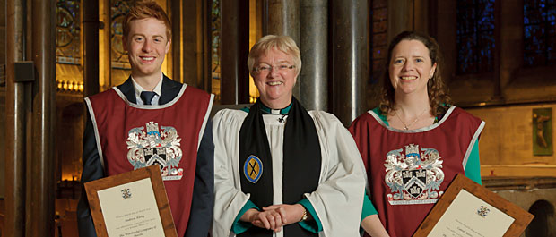 The Dean of Salisbury with stonemasons Andrew Kirby and Carol Merryman